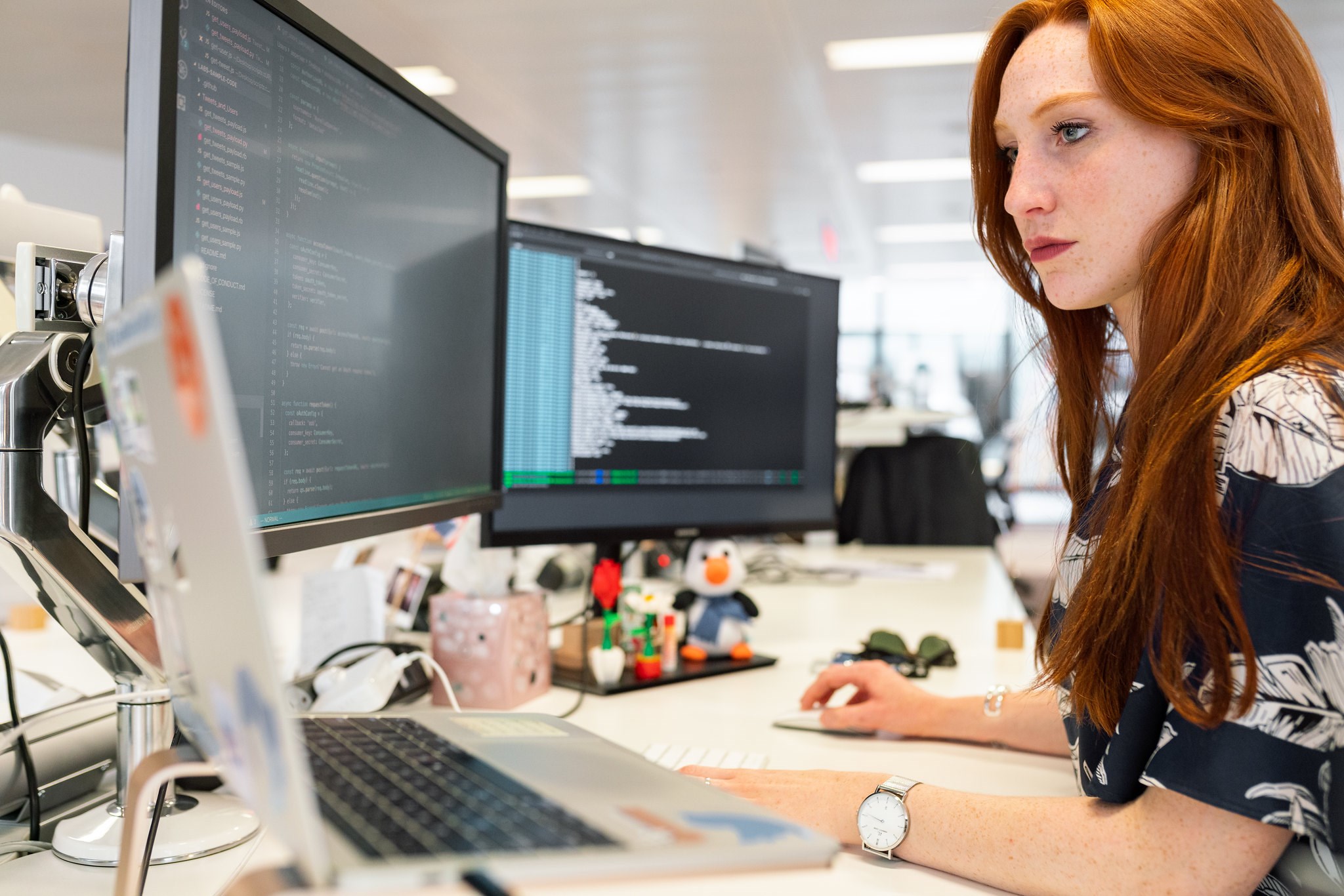 Female Software Engineer Codes At Computer Desk