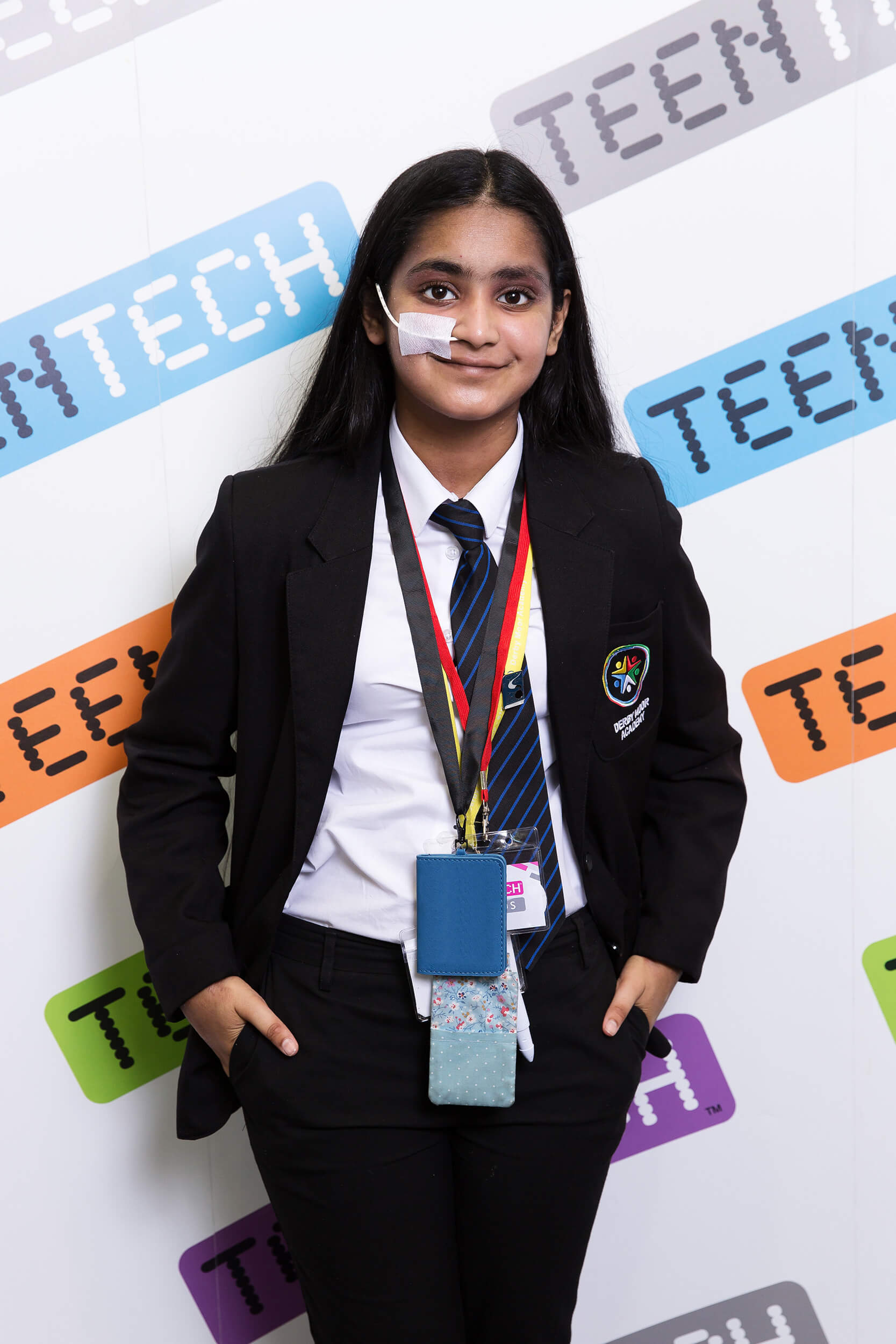 Picture of teenage girl standing in front of Teen Tech background