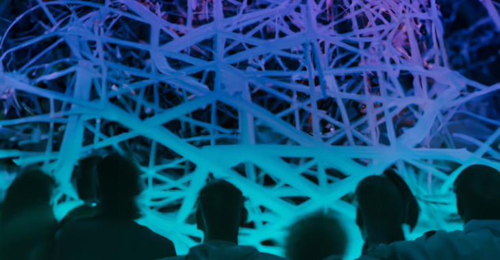 AI-generated image of six people looking at web-like network of lines