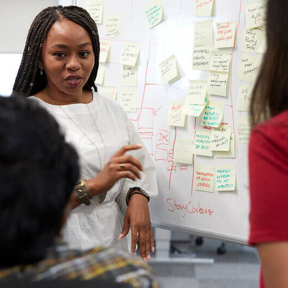 Software engineers in discussion in office