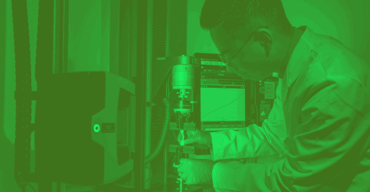 Male Mechanical Engineer Tests Tensile Strength Of Surgical Materials Green Duotone. Credit University Of Leeds