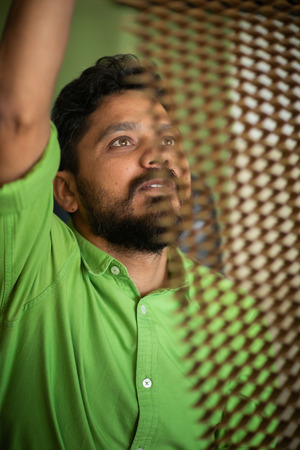 Photo of Abhimanyu looking up at his Hexpressions technology.