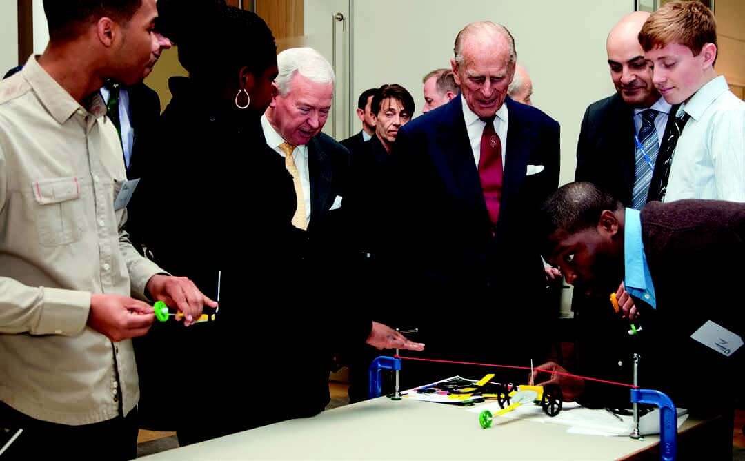 Students showing their project to HRH The Prince Philip.