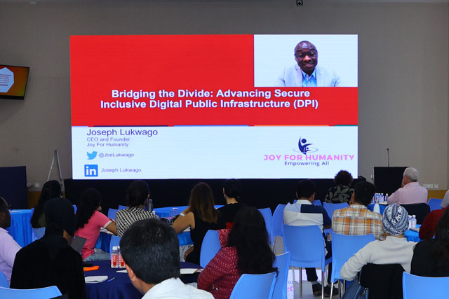 Joseph Lukwago, CEO and founder of Joy for Humanity presenting to delegates