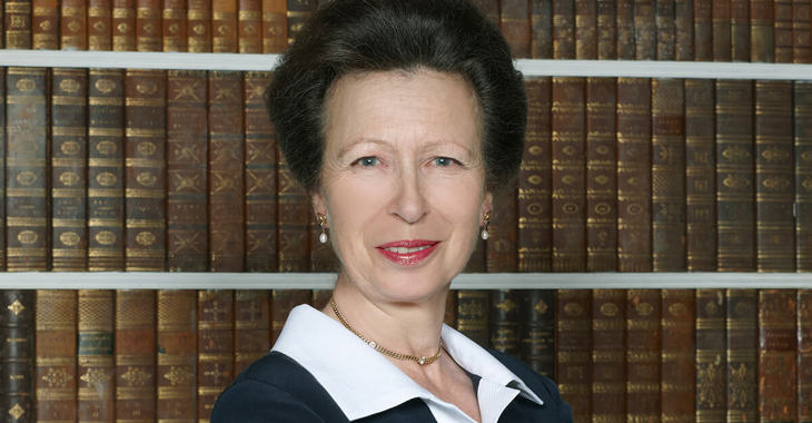 Princess Anne in front of a bookcase