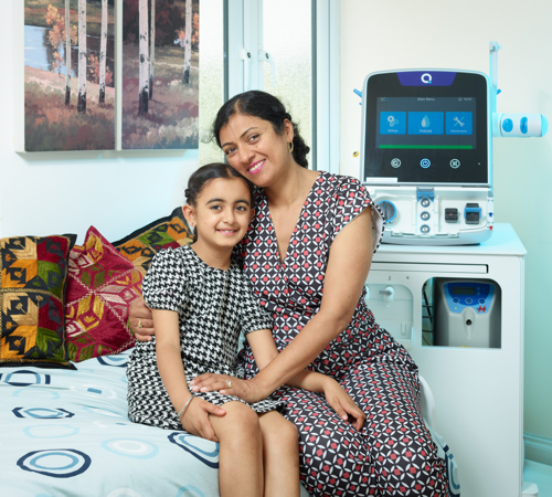 Mother And Child Using Dialysis Machine