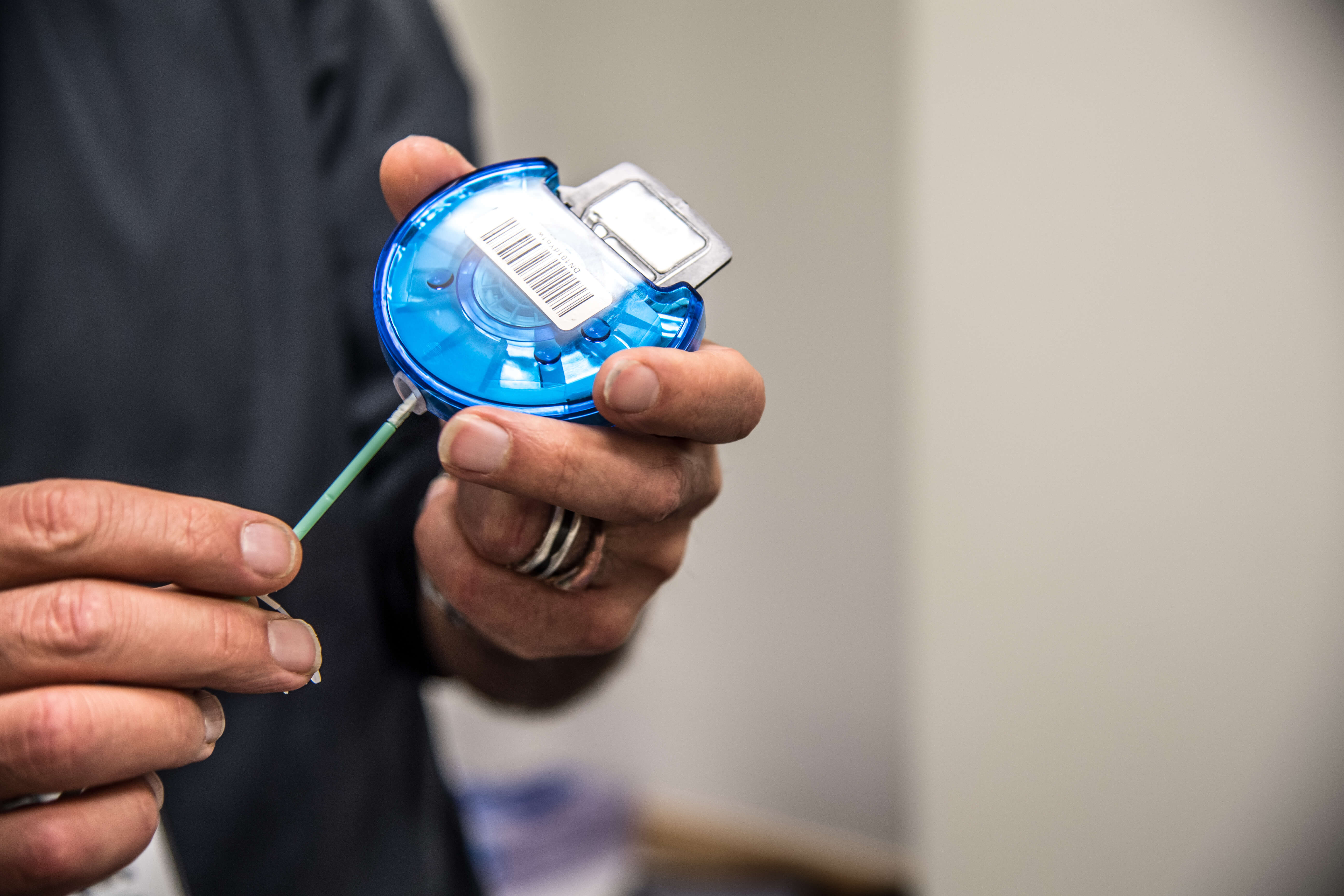 Close of hands holding a test kit.
