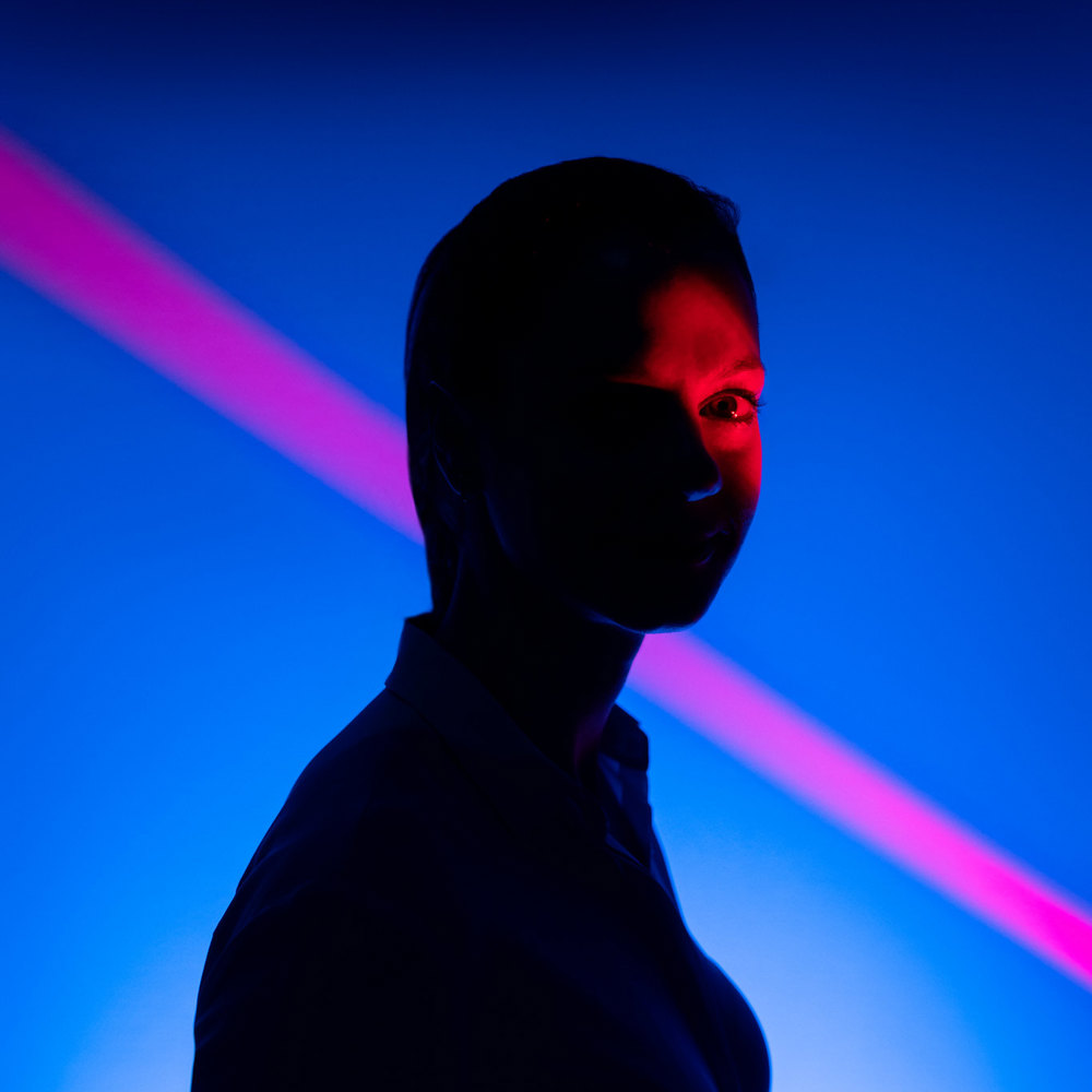 Dark silhoutte of a person looking at the camera