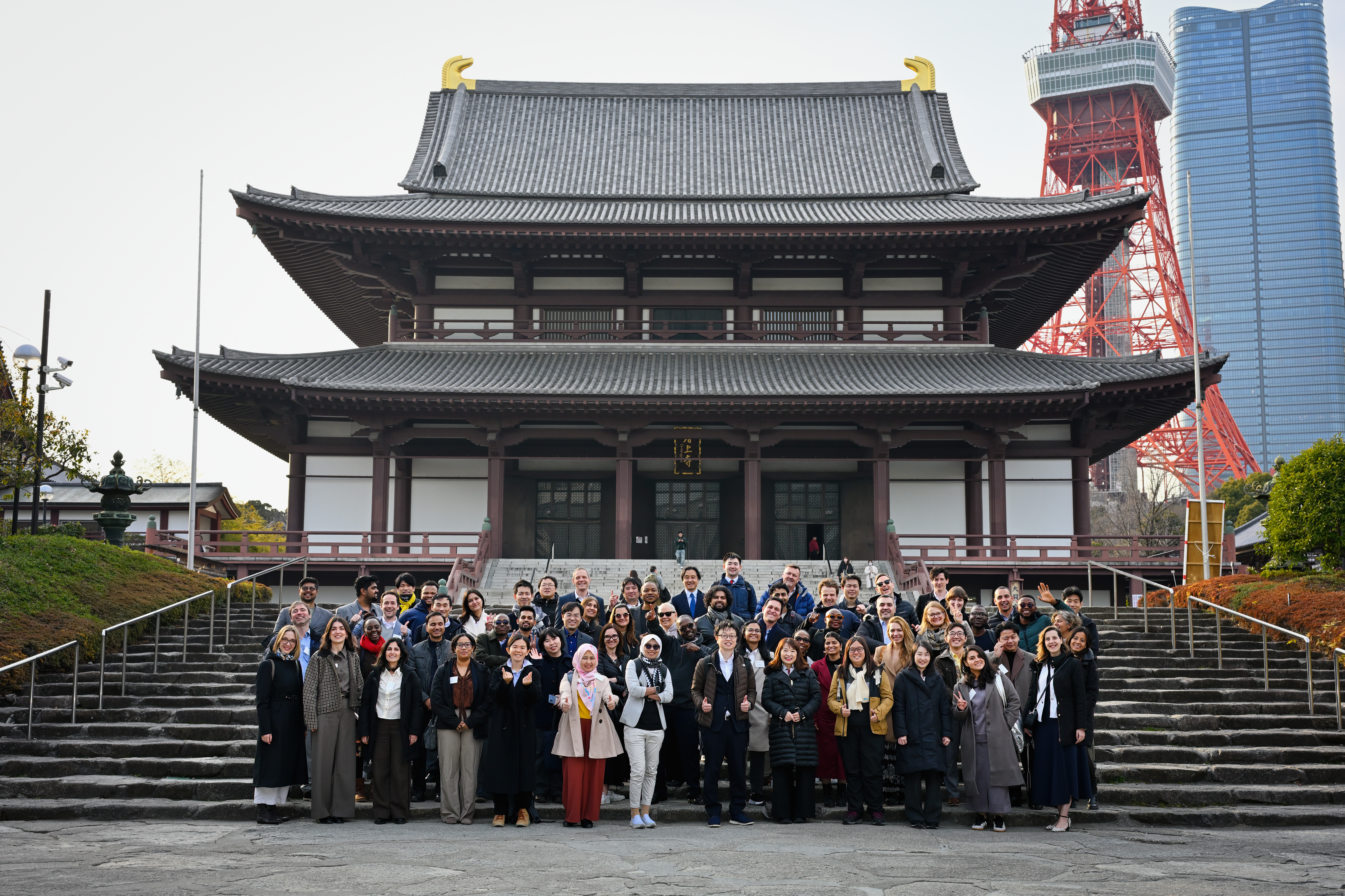 A group picture of participants standing in stairs in front of the Meiji Shrine in Tokyo, Japan