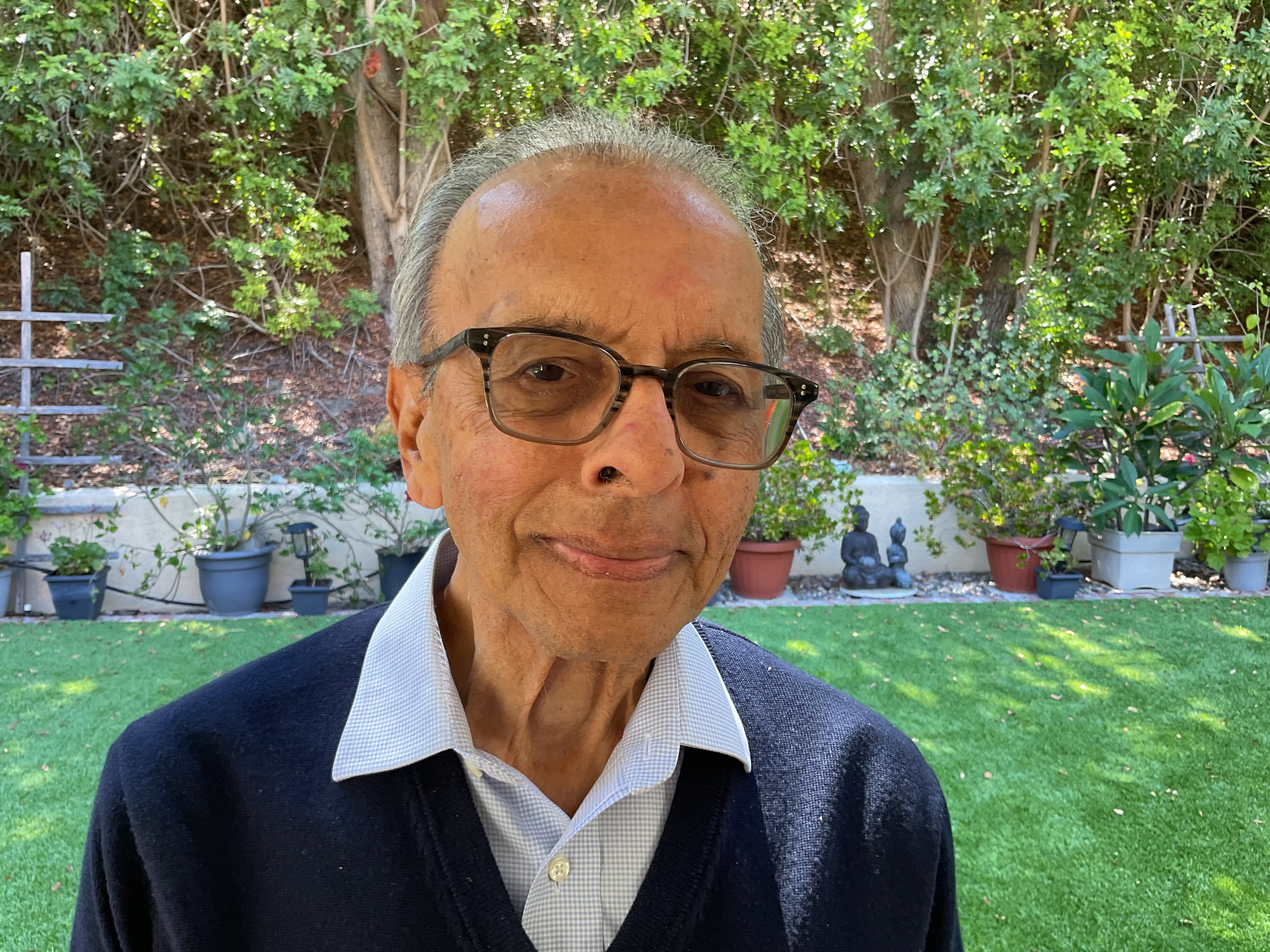 A photograph of prize winner Professor Nasir Ahmed in a garden.