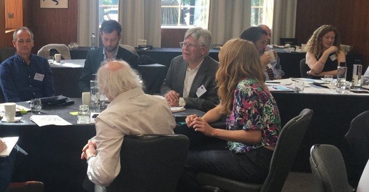 Group during a table discussion - mapping conference