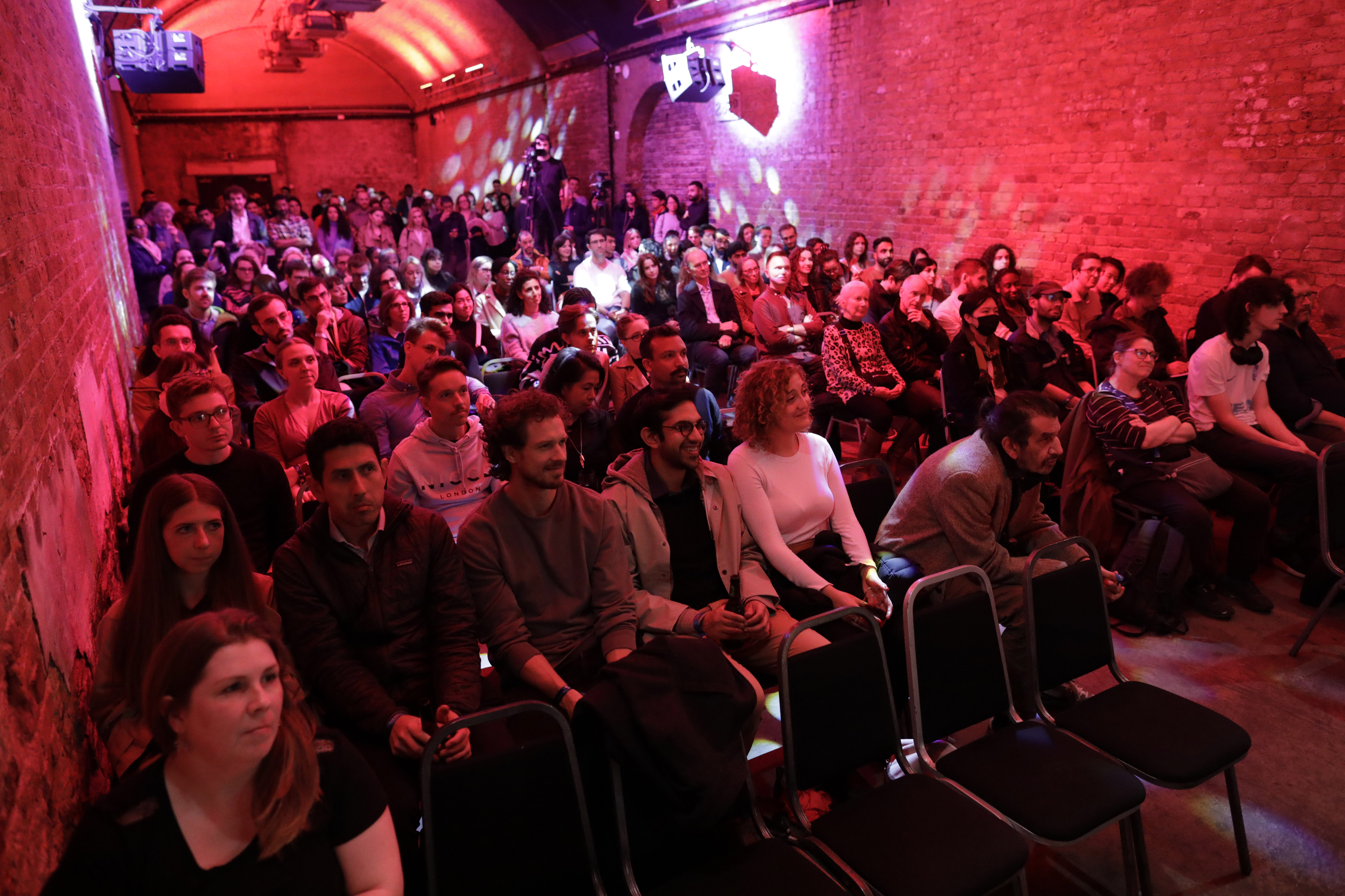 An eager audience watch the first of a series of talks.