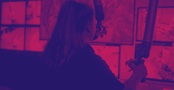 Female Apprentice Mechanical Engineer Uses Robot Pink Duotone