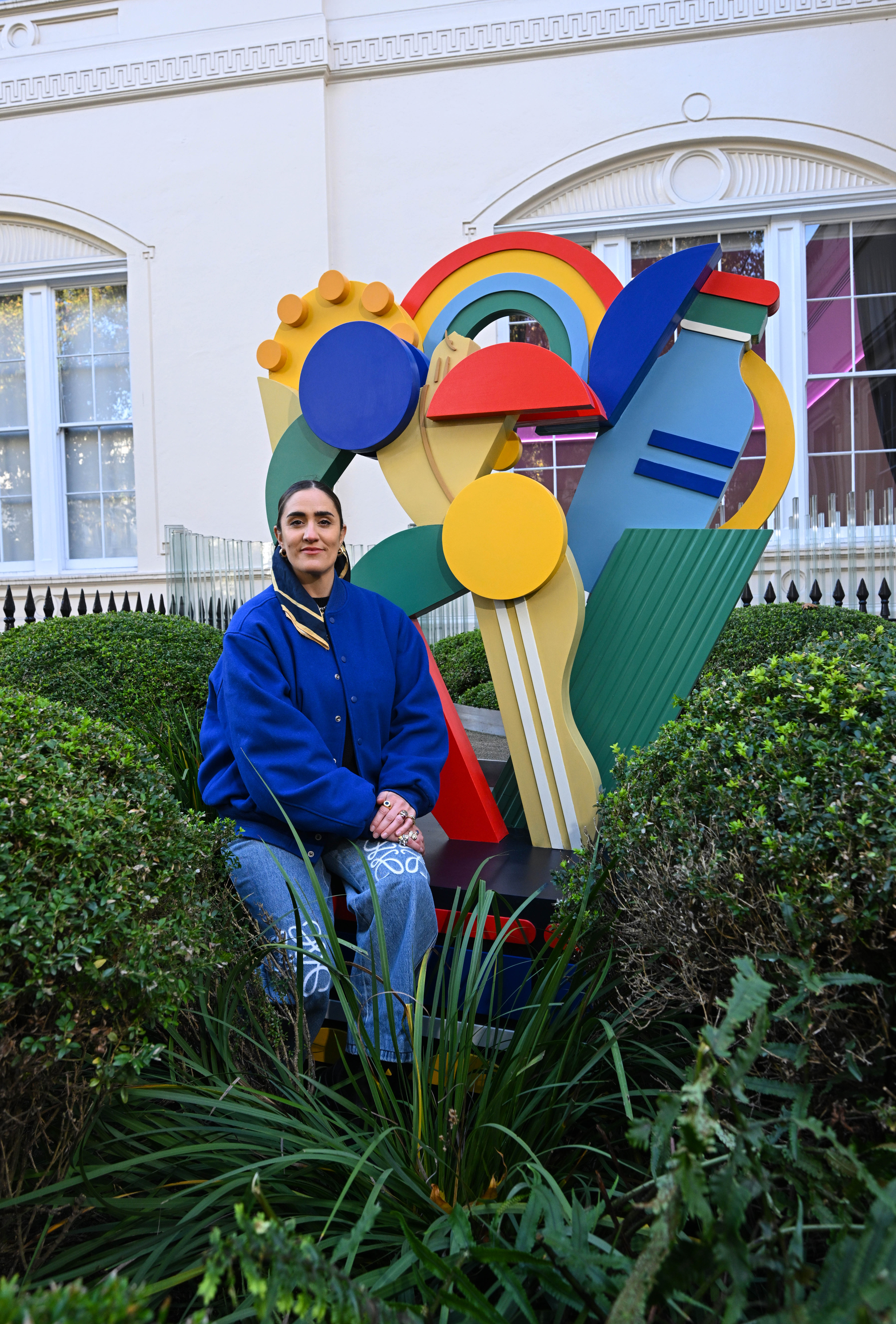 Kelly Anna with her statue at the Academy